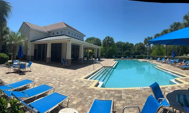 a balcony with wooden floor and city view