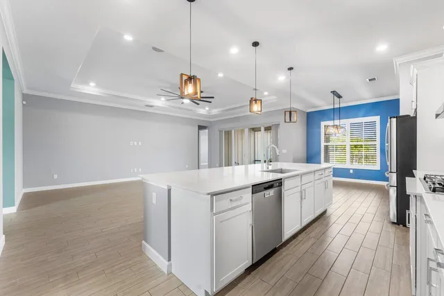 a view of a house with backyard and porch