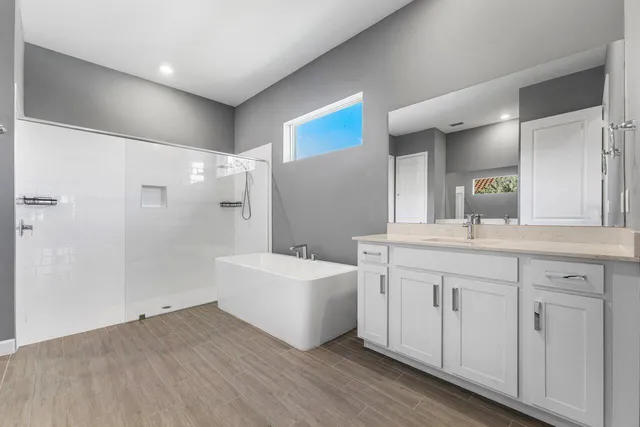 an aerial view of residential houses with outdoor space and swimming pool