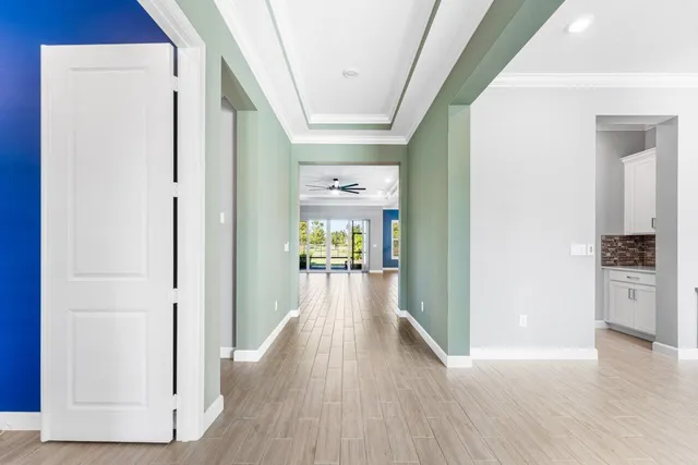 a spacious bathroom with a double vanity sink a mirror and a bathtub