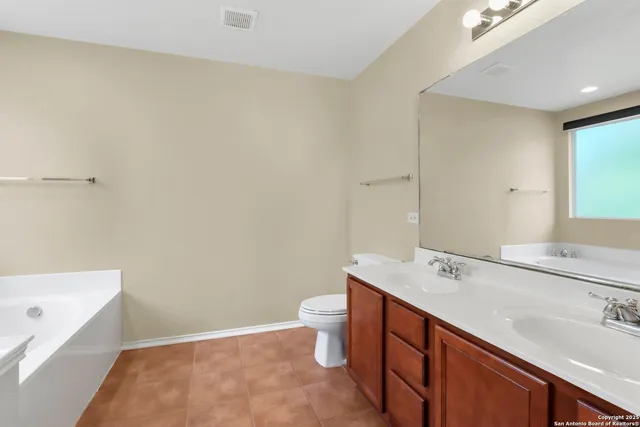a bathroom with a sink a toilet and a bathtub