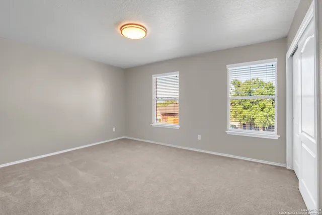 an empty room with windows