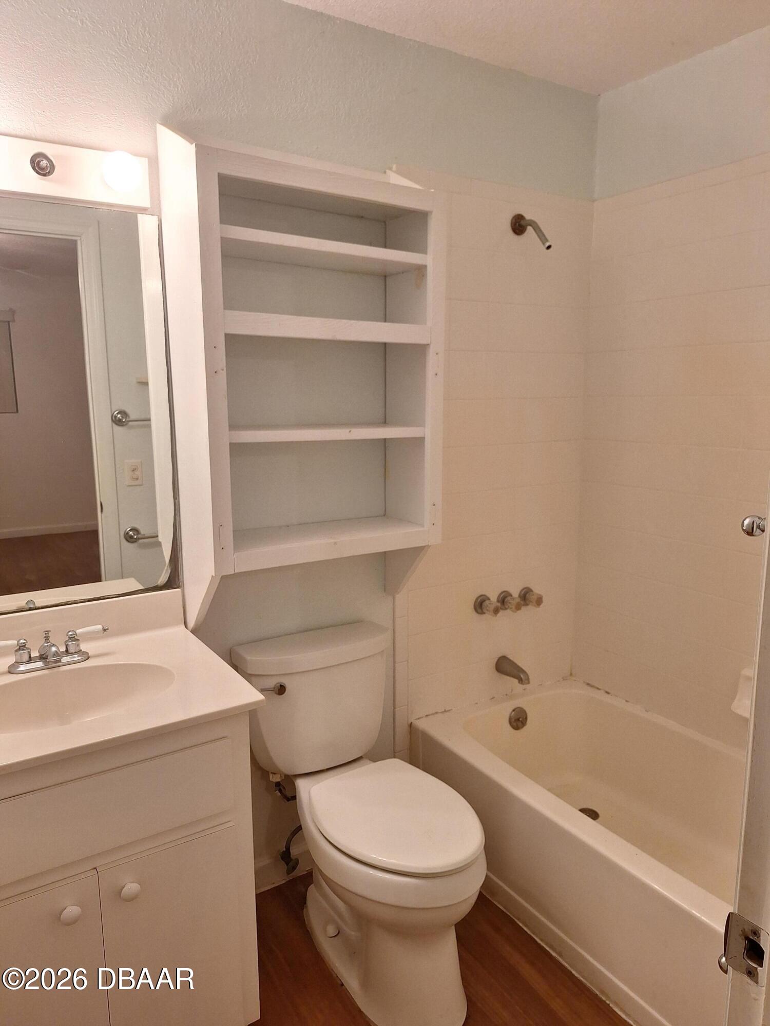 3091 Log Cabin Lane Edgewater, FL 32132 - Photo 15 of 28 a bathroom with a sink a toilet and shower