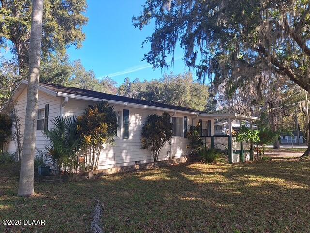 3091 Log Cabin Lane Edgewater, FL 32132 - Photo 2 of 28 a view of street and small trees
