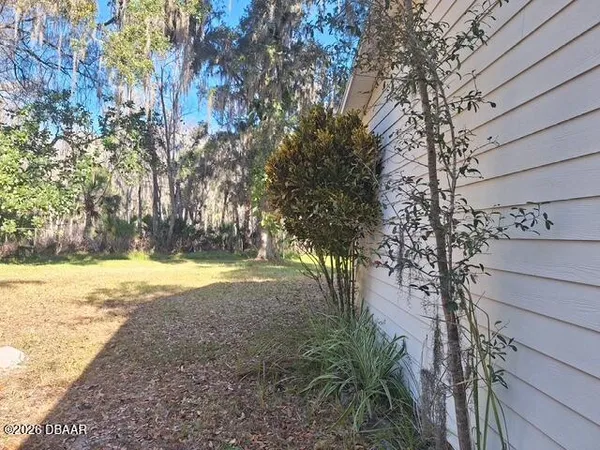 a view of a yard with an outdoor space