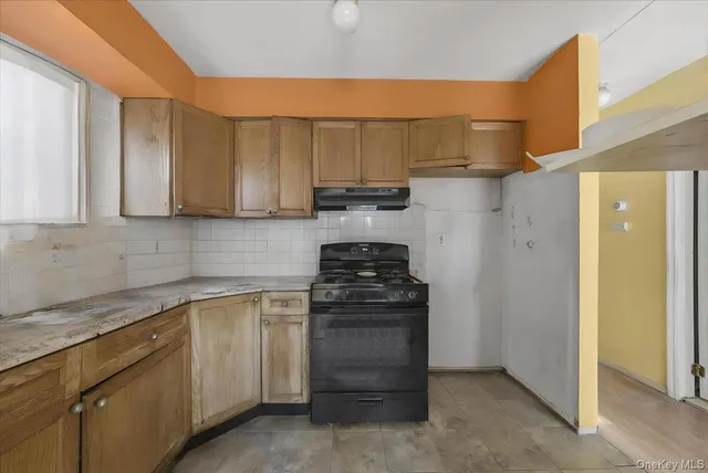 a kitchen with a stove top oven