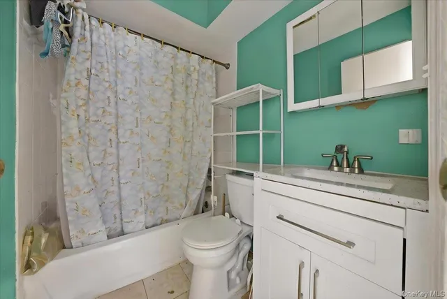 a view of a room with wooden floor and window