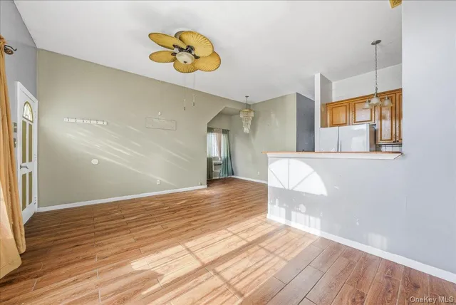 a kitchen with a stove a refrigerator and a sink