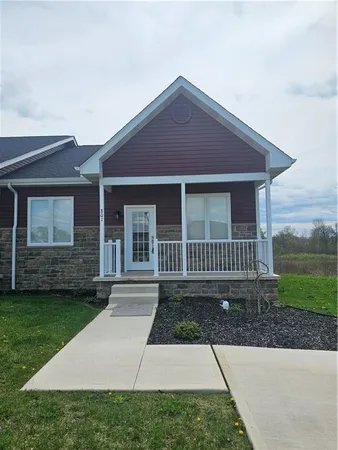 front view of a house with a yard