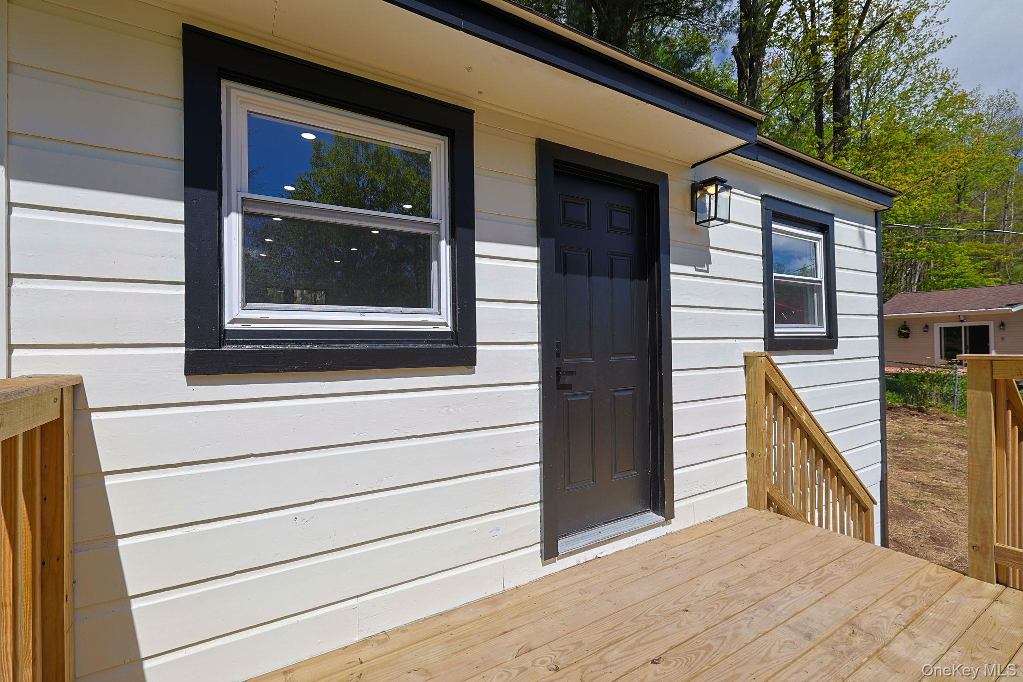 25 Overlook Road Woodbourne, NY 12788 - Photo 18 of 22 a yellow house with a outdoor space