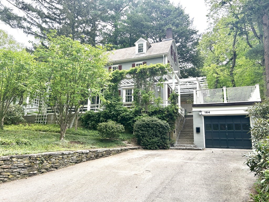a view of a patio with table and chairs and potted plants