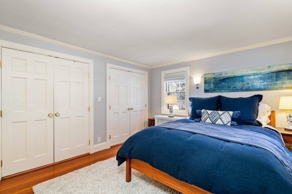 164 Carlton Road Newton, MA 02468 - Photo 16 of 27 a bedroom with a bed and wooden floor