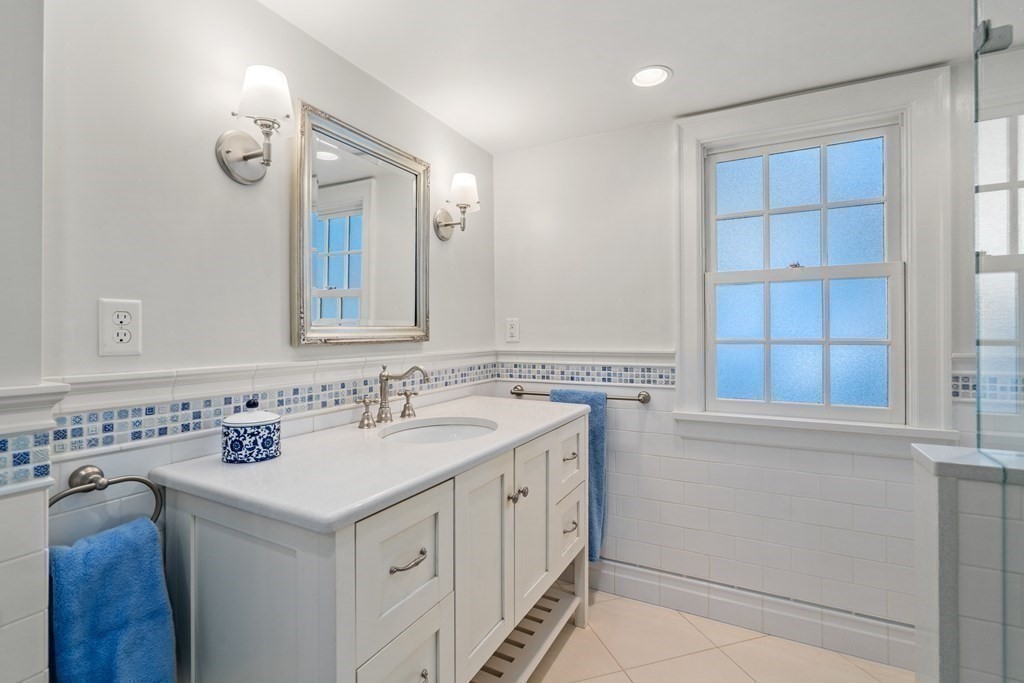 164 Carlton Road Newton, MA 02468 - Photo 18 of 27 a bathroom with a sink and a mirror