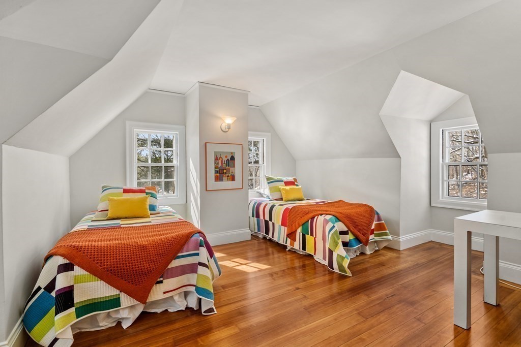 164 Carlton Road Newton, MA 02468 - Photo 22 of 27 a bedroom with furniture and wooden floor