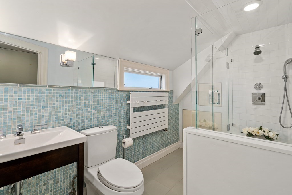 164 Carlton Road Newton, MA 02468 - Photo 24 of 27 a bathroom with a sink a toilet and shower