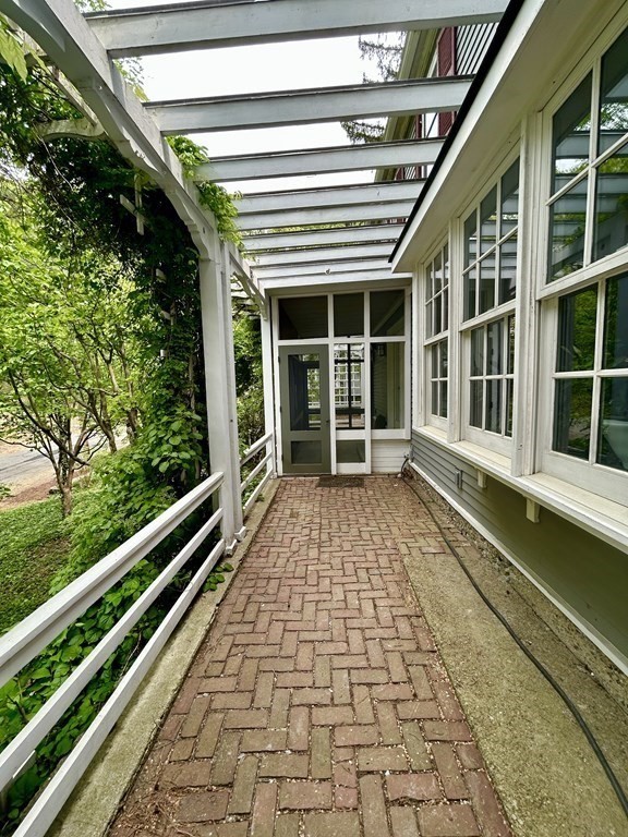 164 Carlton Road Newton, MA 02468 - Photo 25 of 27 a house with trees in front of it