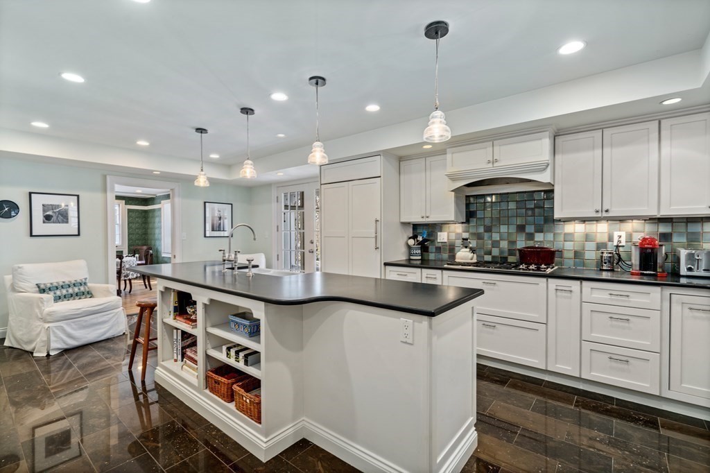 164 Carlton Road Newton, MA 02468 - Photo 5 of 27 a kitchen with stainless steel appliances granite countertop a sink and stove top oven