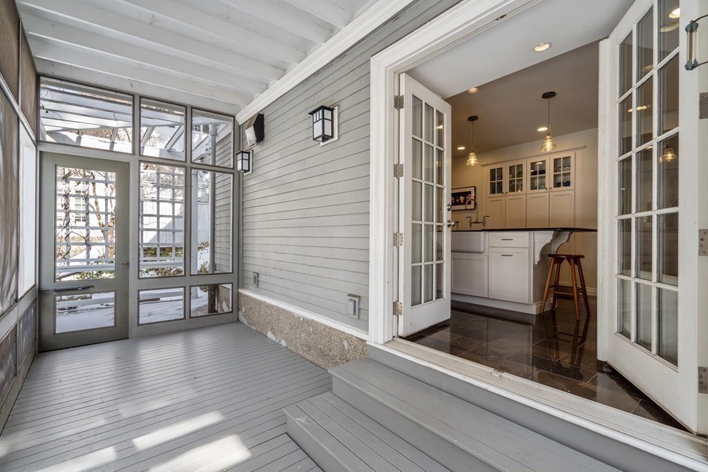 164 Carlton Road Newton, MA 02468 - Photo 6 of 27 a view of an entryway with wooden floor and door