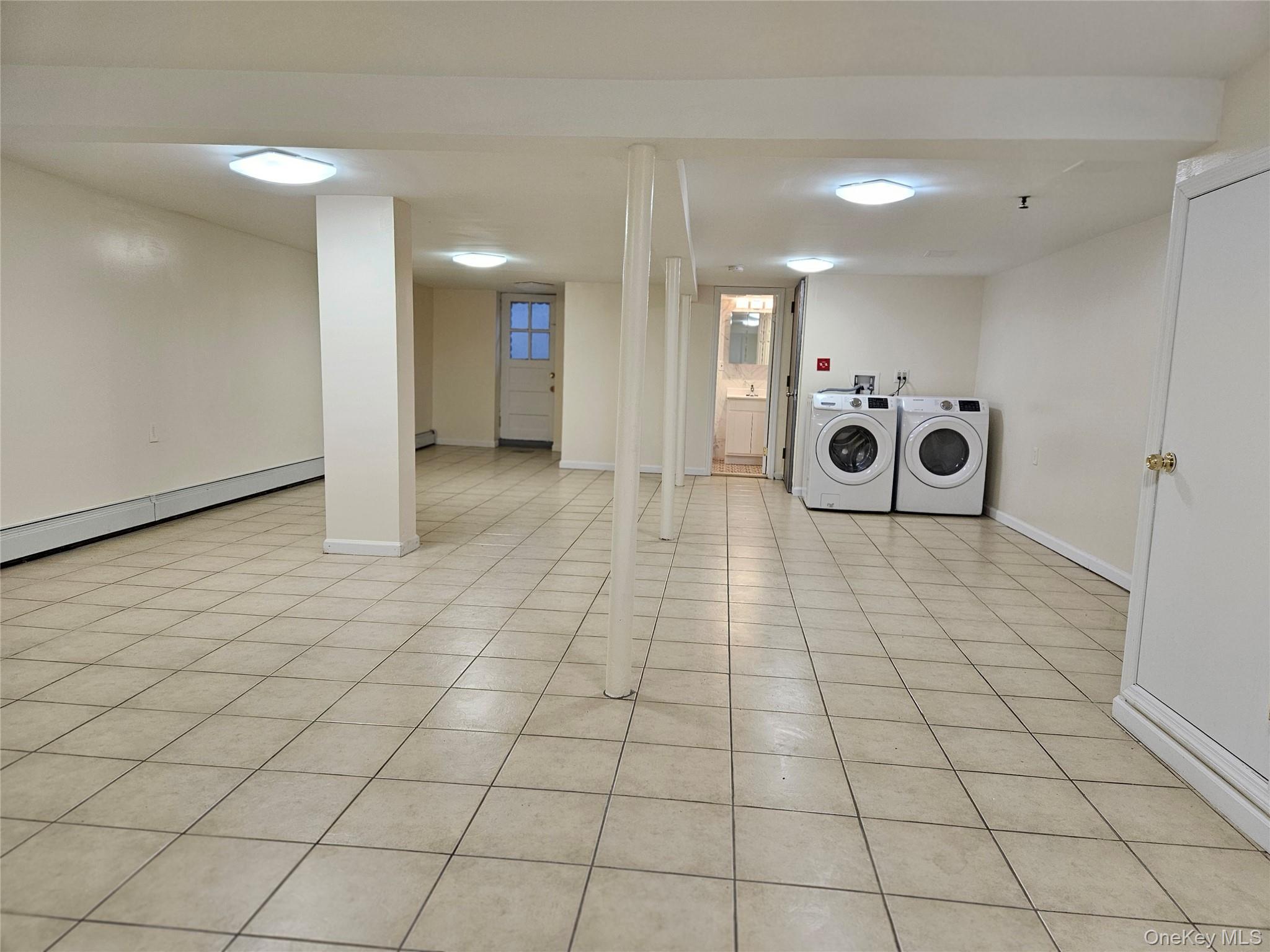 76-40 170th Street, Unit 1 Queens, NY 11366 - Photo 14 of 17 a bathroom with a sink and a mirror