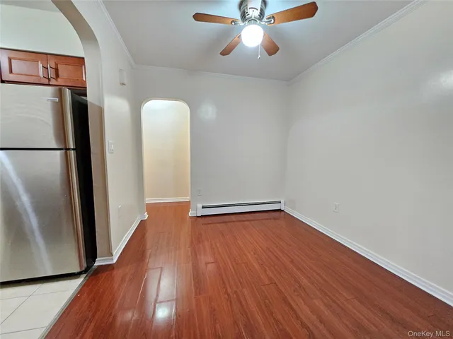 a view of a hardwood floor in a kitchen