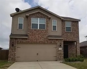 a front view of a house with garage