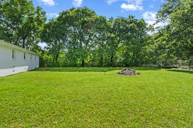 a view of a backyard with a small cabin