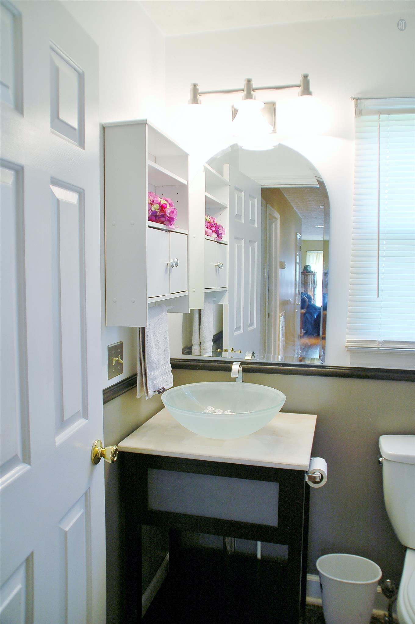 7112 Totty Road Fairview, TN 37062 - Photo 12 of 14 a bathroom with a sink vanity and a mirror