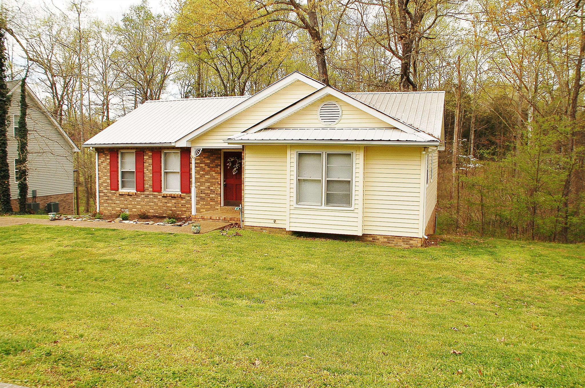 7112 Totty Road Fairview, TN 37062 - Photo 2 of 14 a front view of a house with a yard