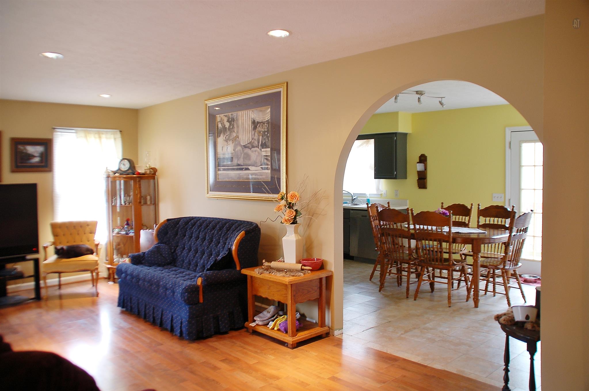 7112 Totty Road Fairview, TN 37062 - Photo 5 of 14 a living room with furniture and a large mirror next to a window