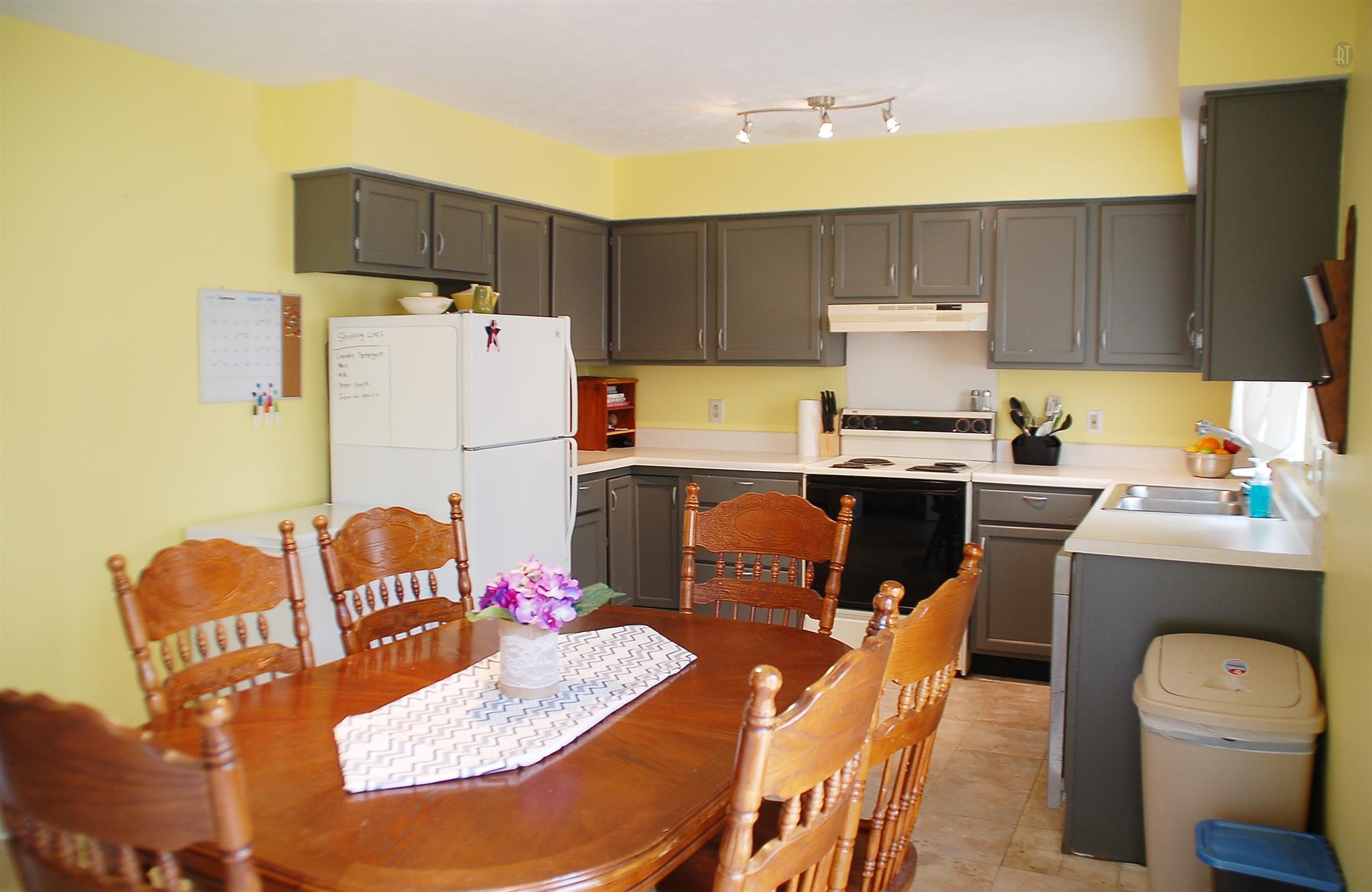 7112 Totty Road Fairview, TN 37062 - Photo 6 of 14 a kitchen with stainless steel appliances furniture refrigerator sink and stove