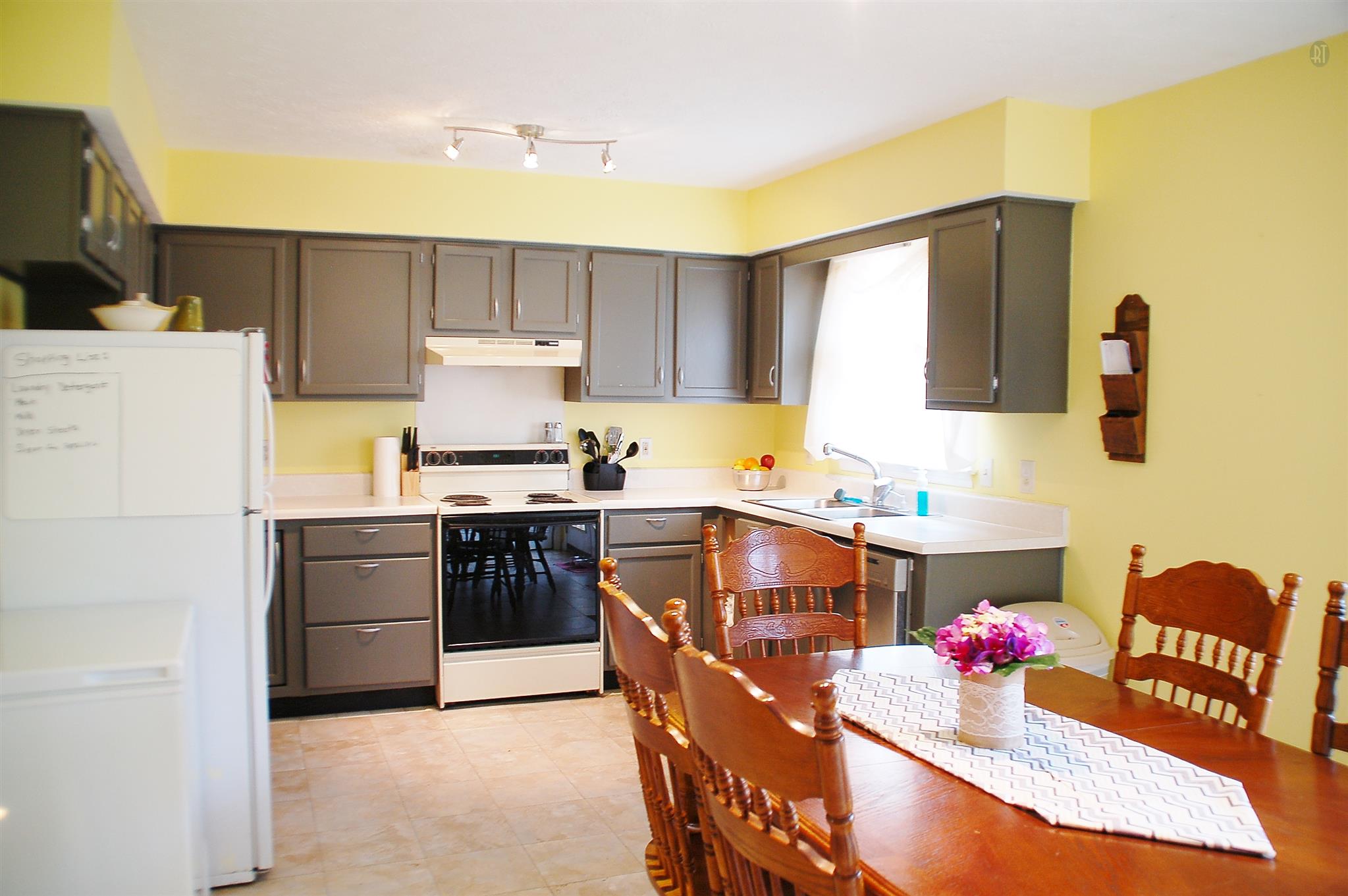 7112 Totty Road Fairview, TN 37062 - Photo 7 of 14 a kitchen with a refrigerator and a stove