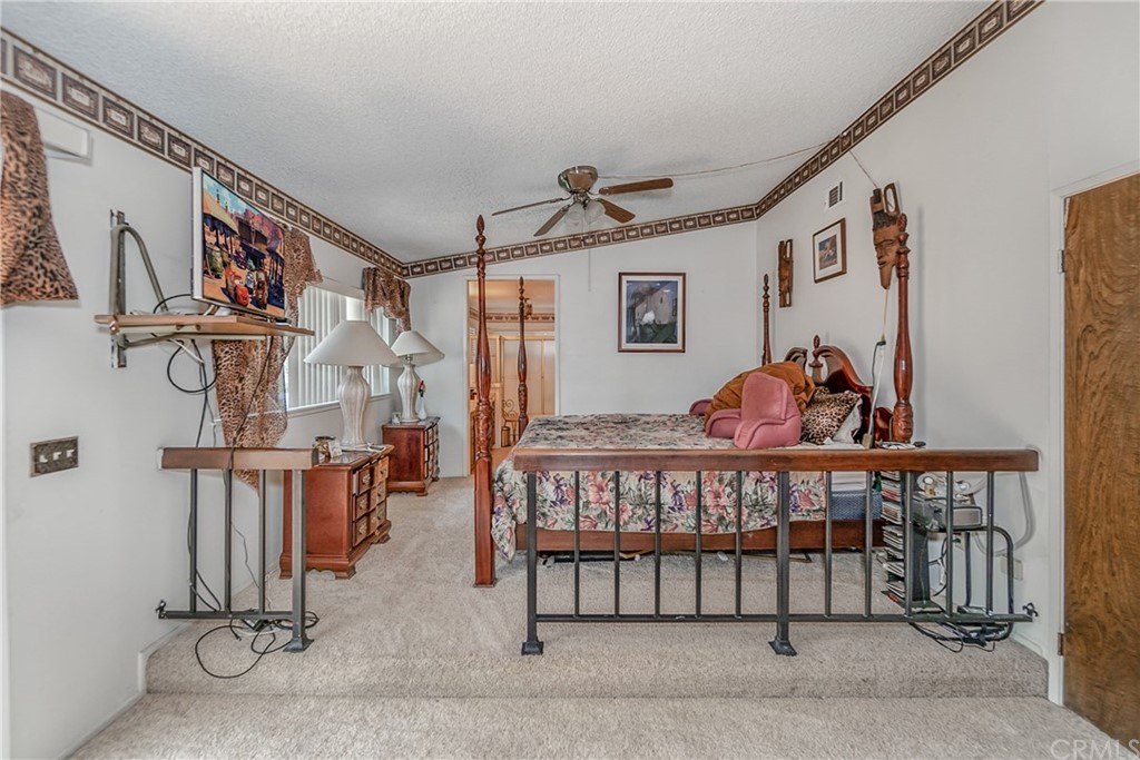 6717 Rycroft Drive Riverside, CA 92506 - Photo 14 of 28 a bedroom with furniture and a window