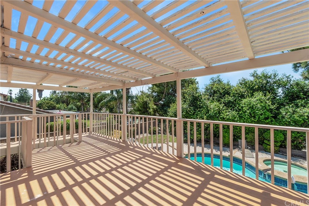 6717 Rycroft Drive Riverside, CA 92506 - Photo 18 of 28 a view of balcony with wooden floor and fence