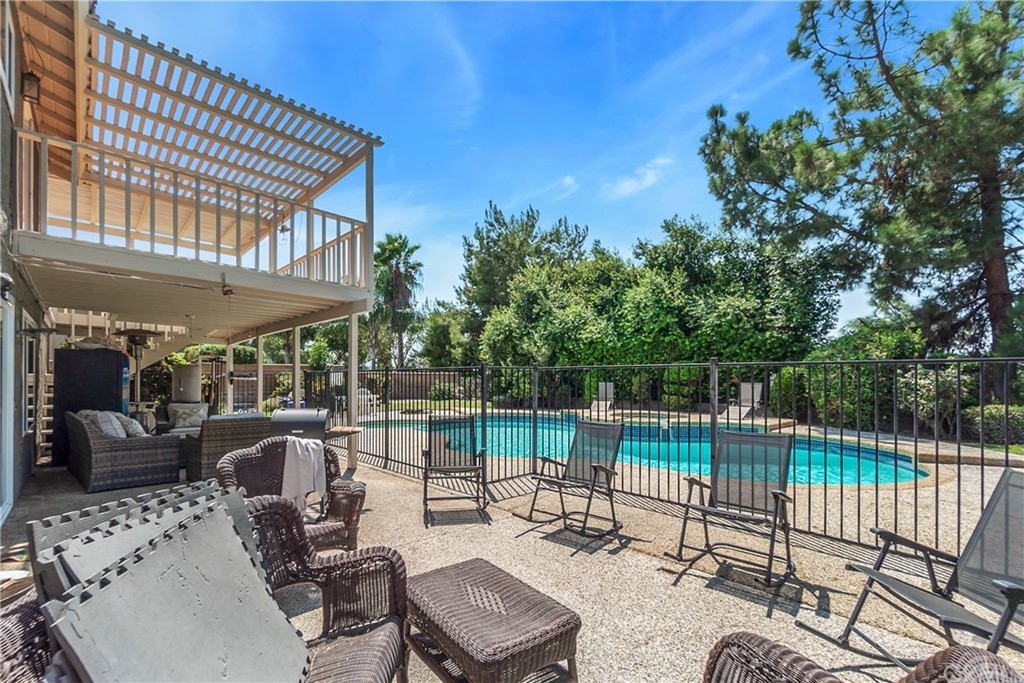 6717 Rycroft Drive Riverside, CA 92506 - Photo 22 of 28 a view of a patio with couches table and chairs and potted plants