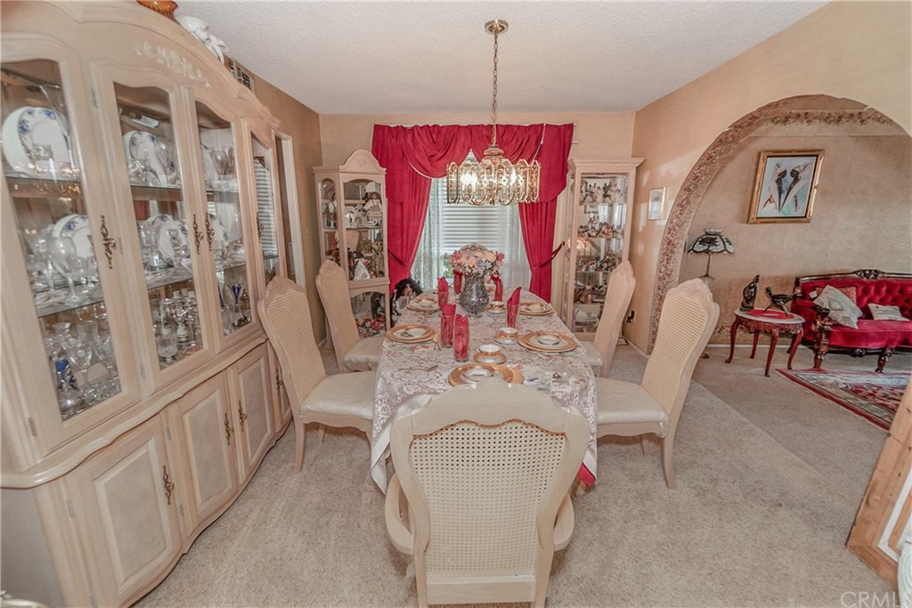 6717 Rycroft Drive Riverside, CA 92506 - Photo 5 of 28 a view of a dining room with furniture and chandelier