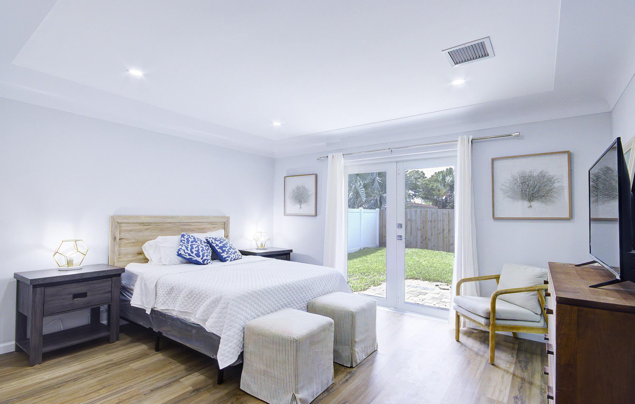 1950 Northeast 30th Street Lighthouse Point, FL 33064 - Photo 13 of 25 1950 guest room backyard access