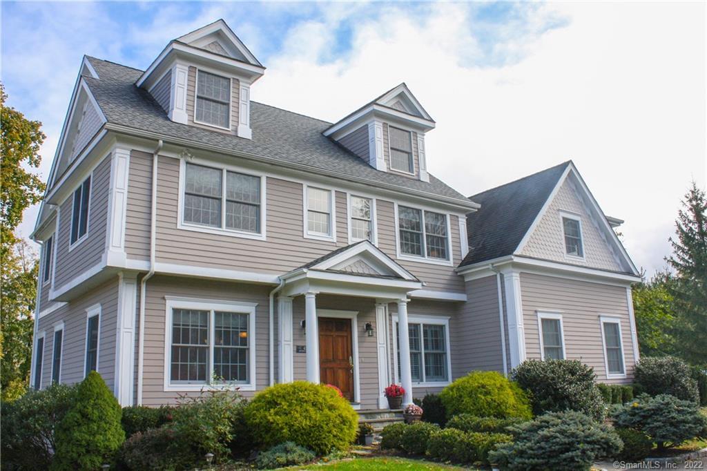 41 A Catoonah Street Ridgefield, CT 06877 - Photo 1 of 1 a front view of a house with garden