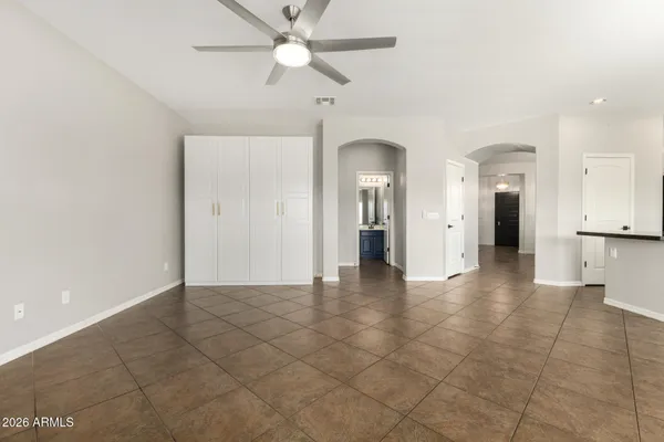 a kitchen with stainless steel appliances granite countertop a refrigerator and a stove