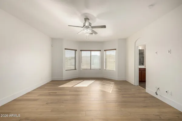 a backyard of a house with fire pit and trees