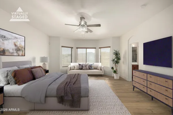 a bedroom with a bed and a couch