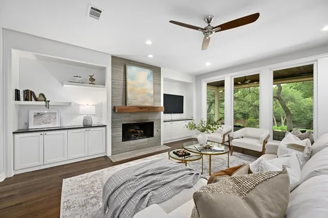 a living room with furniture and a fireplace