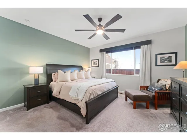 a spacious bedroom with a bed and window