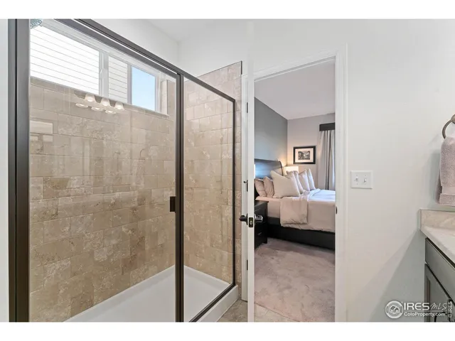 a en suite bathroom with a sink and a mirror