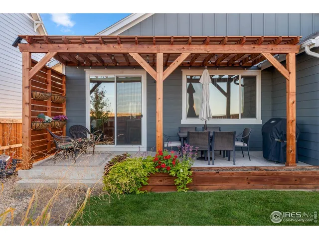 a view of a chairs and table in a patio
