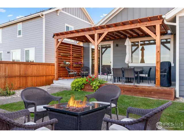 a view of an outdoor sitting area with brick walls