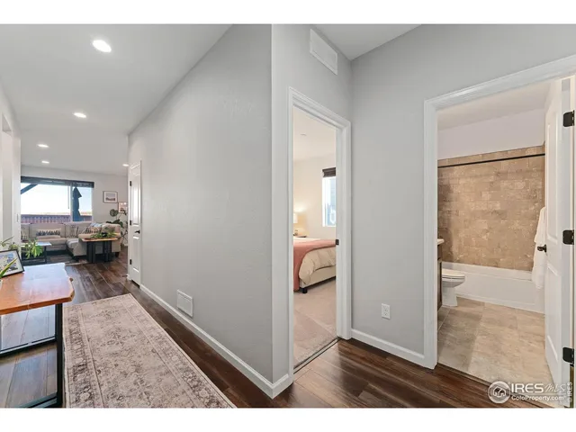 a view of a living room and a wooden floor