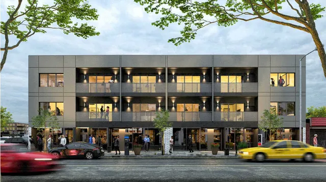 a view of building with car parked