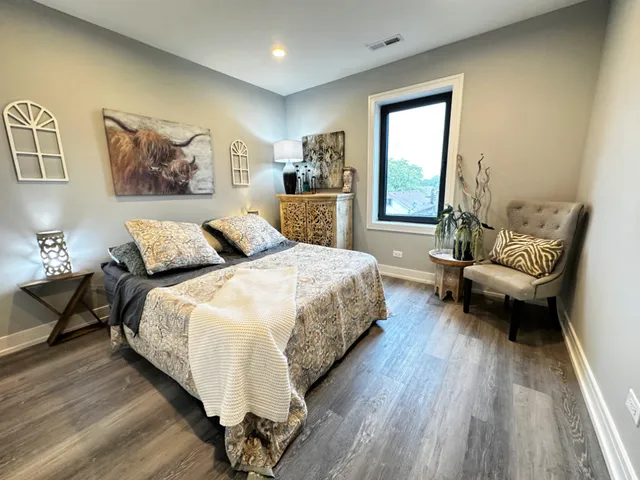 a bedroom with bed and window