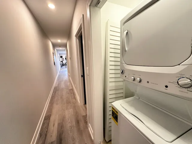 a bathroom with a sink and mirror with toilet
