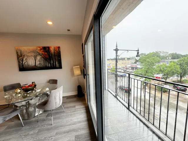 a living room with furniture and a floor to ceiling window